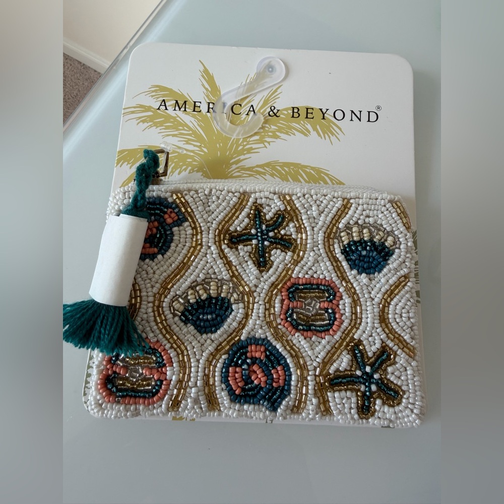 America & beyond Beaded cream Seashell Pouch with Teal Tassel
